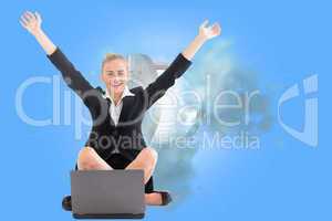 Composite image of businesswoman sitting in front of laptop with