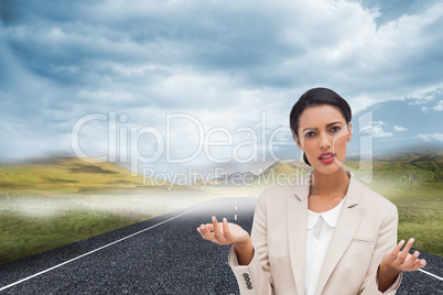 Composite image of confused businesswoman standing