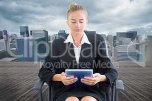 Composite image of businesswoman sitting on swivel chair with ta