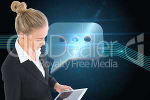 Composite image of businesswoman holding tablet