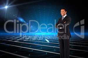 Composite image of businessman with folded arms