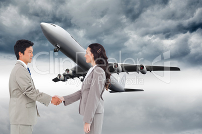 Composite image of side view of hand shaking trading partners