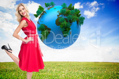 Composite image of smiling blonde standing hands on hips