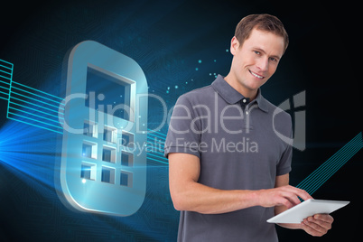 Composite image of smiling young man with tablet computer