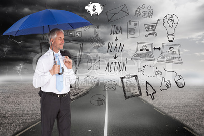 Composite image of happy businessman holding umbrella