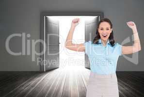 Composite image of victorious stylish businesswoman posing