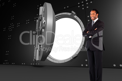 Composite image of businessman with folded arms