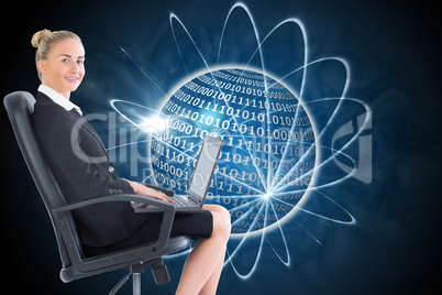 Composite image of businesswoman sitting on swivel chair with la Composite image of businesswoman sitting on swivel chair with la