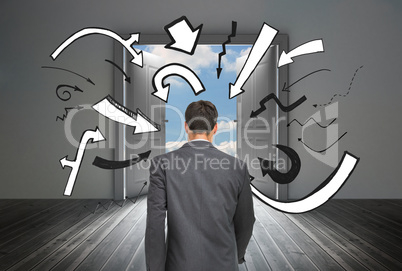 Composite image of young businessman walking away from camera