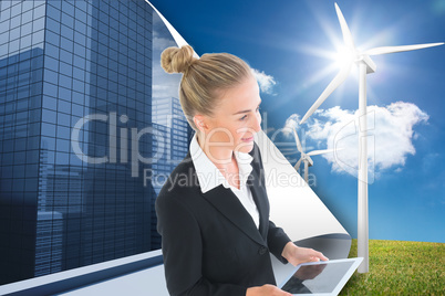 Composite image of businesswoman holding new tablet