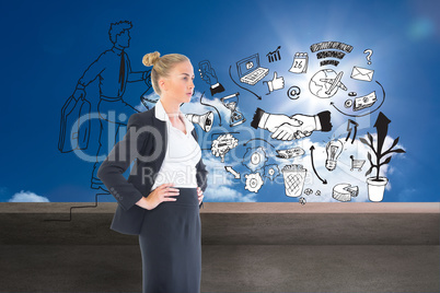 Composite image of businesswoman standing with hands on hips Composite image of businesswoman standing with hands on hips
