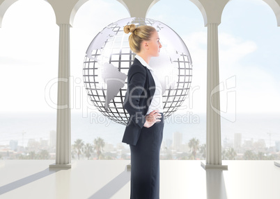 Composite image of businesswoman standing with hands on hips