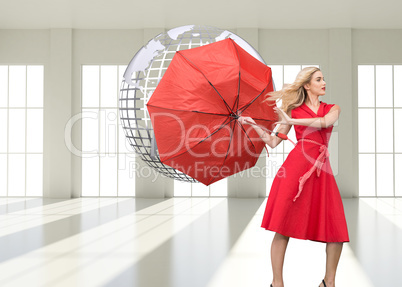 Composite image of elegant blonde holding umbrella