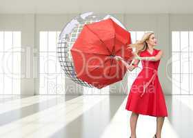 Composite image of elegant blonde holding umbrella