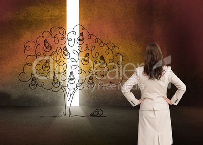 Composite image of businesswoman standing back to camera