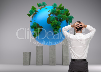 Composite image of businessman standing back to camera hands on