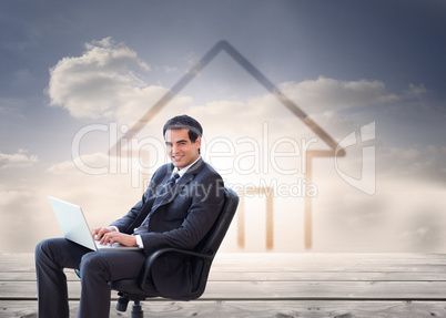 Composite image of young businessman sitting on an armchair work