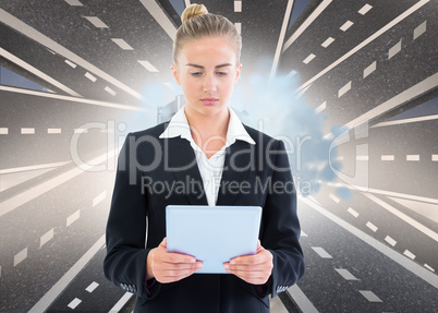 Composite image of businesswoman holding tablet