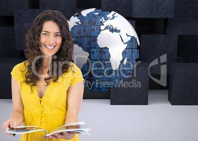 Composite image of cheerful curly haired brunette reading magazi