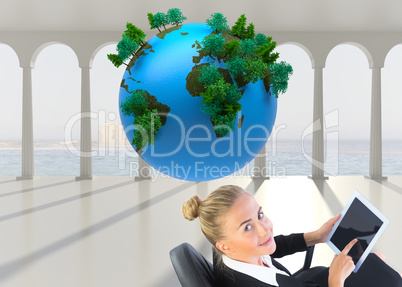 Composite image of businesswoman sitting on swivel chair with ta