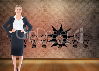 Composite image of businesswoman standing with hands on hips