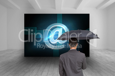 Composite image of rear view of classy businessman holding grey