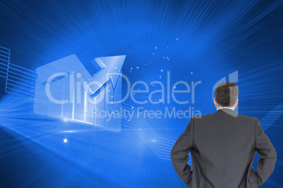 Composite image of businessman standing back to the camera with