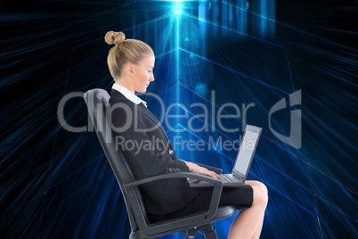 Composite image of businesswoman sitting on swivel chair with la