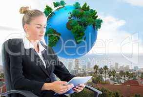 Composite image of businesswoman sitting on swivel chair with ta