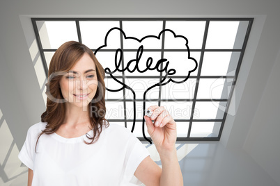 Composite image of smiling businesswoman holding marker