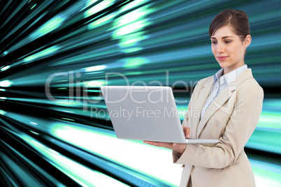 Composite image of confident businesswoman holding laptop