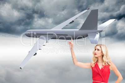 Composite image of elegant blonde standing pointing