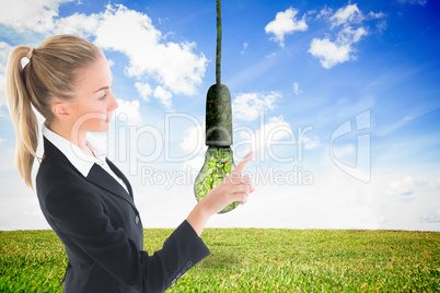 Composite image of businesswoman pointing somewhere