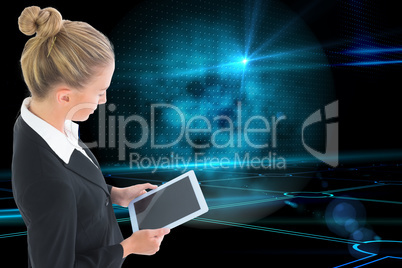 Composite image of businesswoman holding tablet