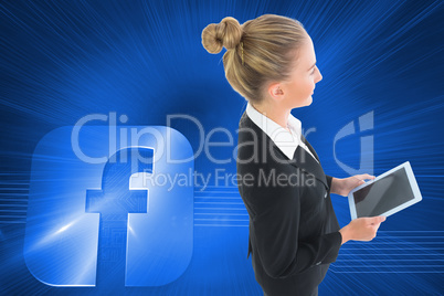 Composite image of businesswoman holding new tablet