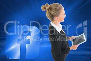 Composite image of businesswoman holding new tablet