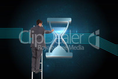 Composite image of businessman standing on ladder