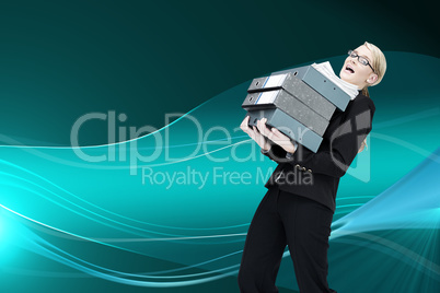 Composite image of businesswoman carrying folders