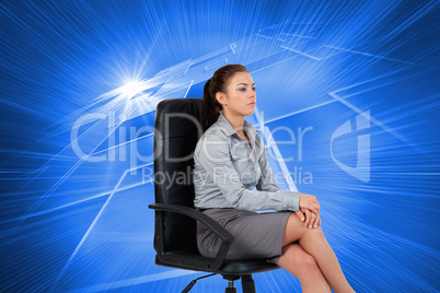 Composite image of portrait of a serious businesswoman sitting o