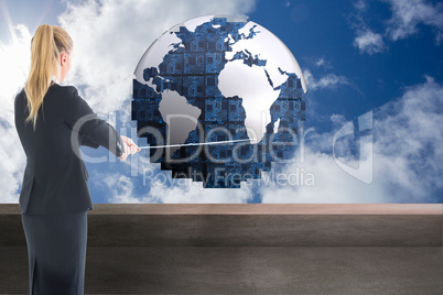 Composite image of businesswoman pulling a rope