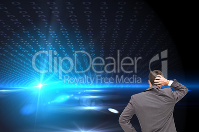 Composite image of young businessman standing back to camera scr