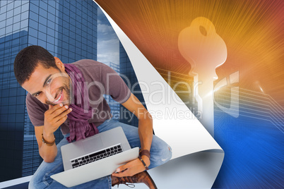 Composite image of thoughtful man sitting on floor using laptop