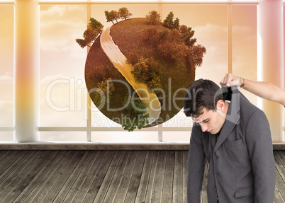Composite image of businessman hanging