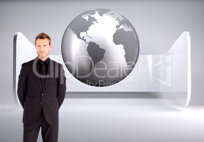 Composite image of young businessman looking at the camera