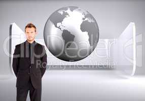 Composite image of young businessman looking at the camera