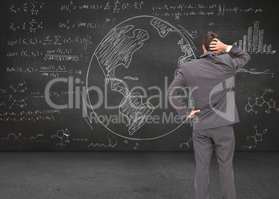 Composite image of young businessman standing back to camera scr