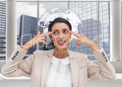 Composite image of confident young businesswoman pointing her he