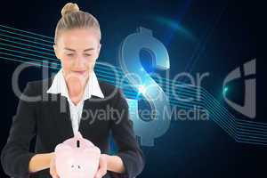 Composite image of businesswoman holding piggy bank