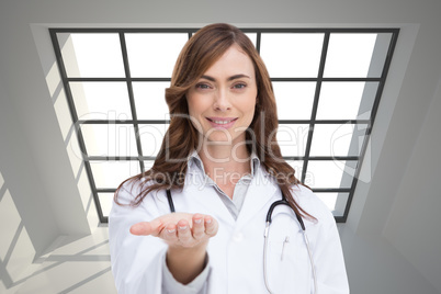 Composite image of smiling doctor presenting her hand