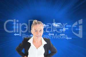 Composite image of businesswoman standing with hands on hips